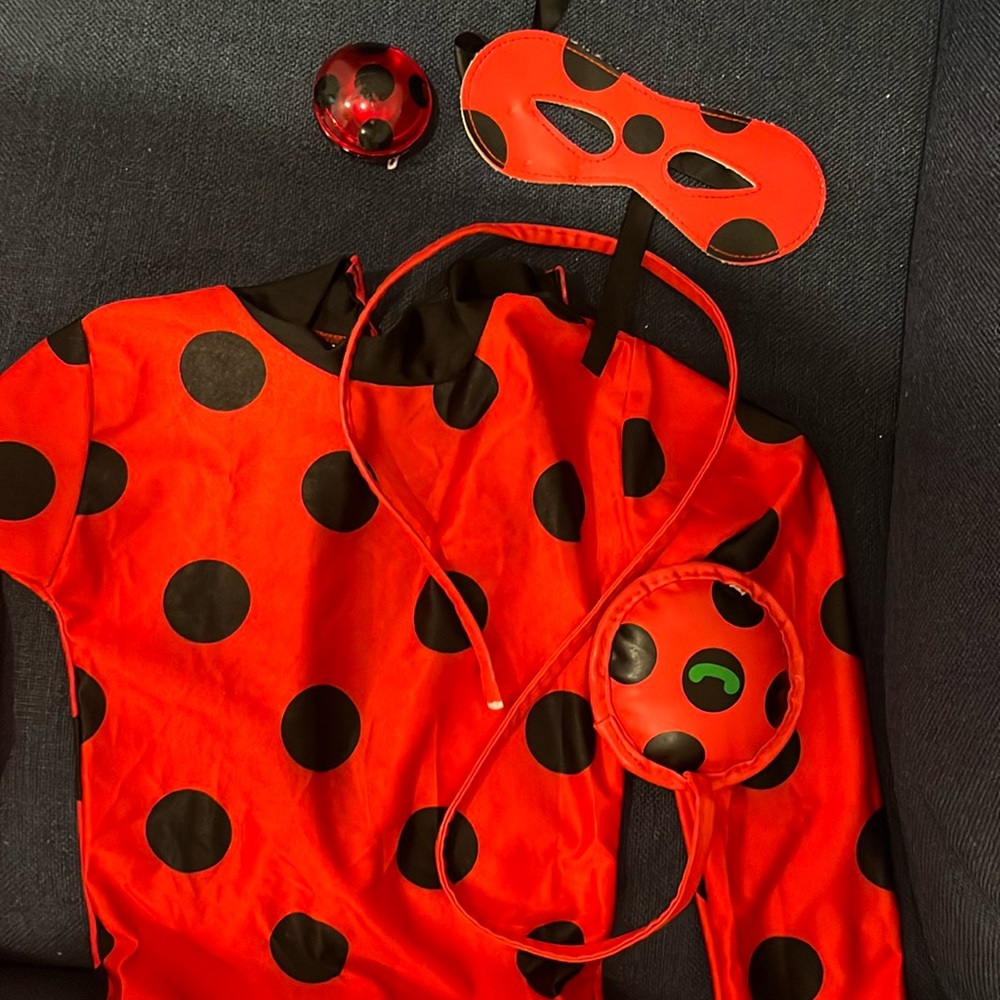 Miraculous ladybug costume, yo-yo, purse, eye mask onesie. Size M